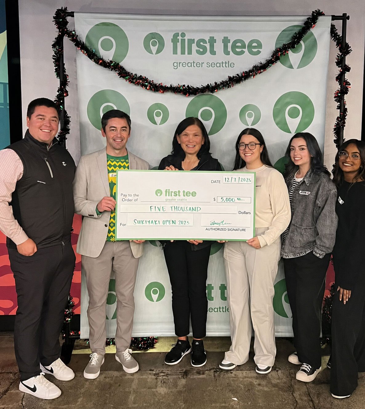 Sukiyaki Open presents a donation to First Tee Greater Seattle